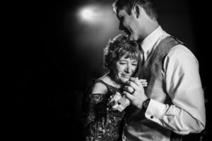 mother and son dancing at madison Wisconsin wedding in black and white